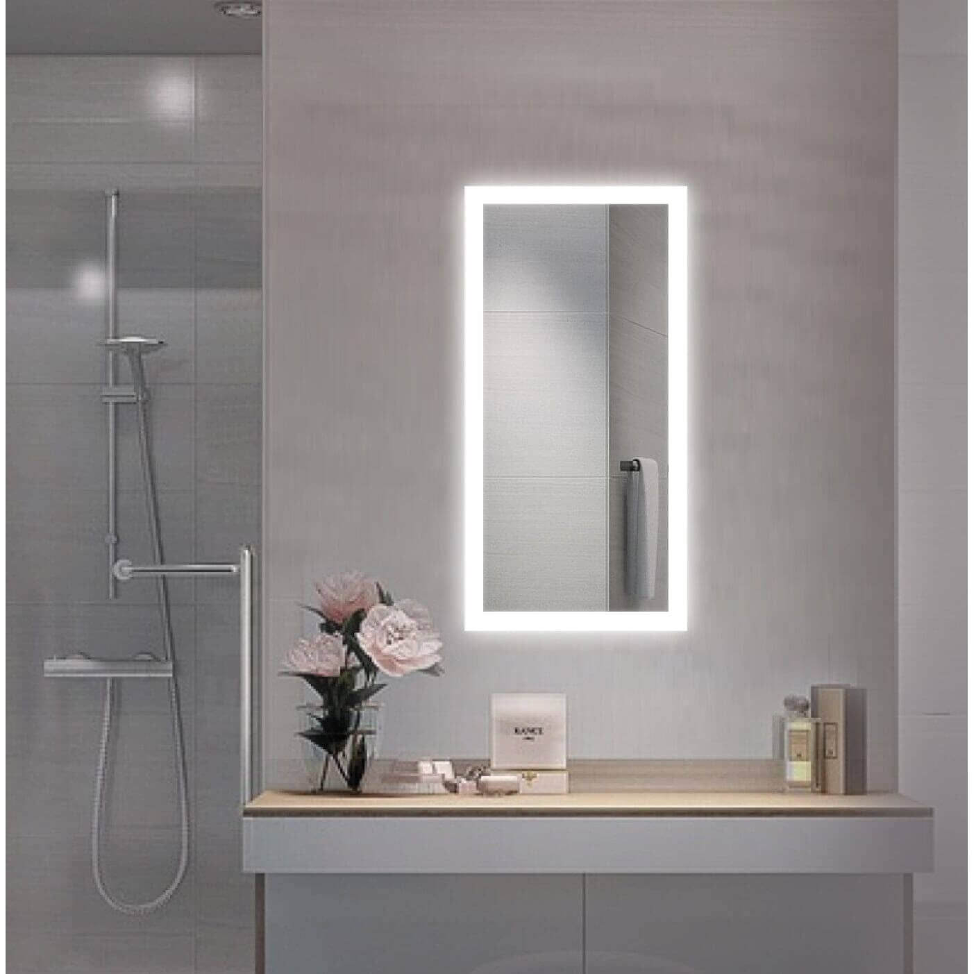 Luxurious bathroom w/ Krugg Bijou 15 X 30 LED mirror complemented by a glass shower stall