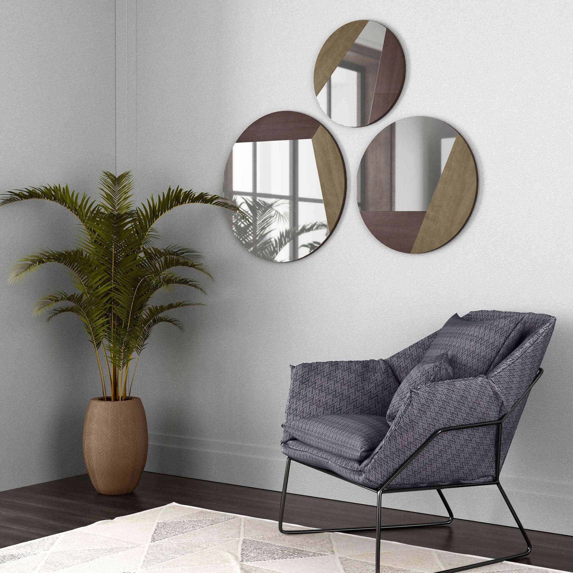 Wall decor with Maklin mirror set above modern gray chair