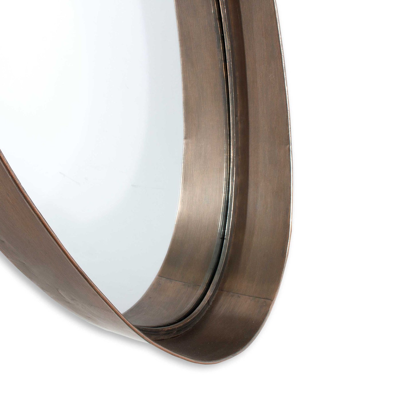Macklin close-up of the curved, antique bronze frame, highlighting the textured metallic finish and reflective surface.
