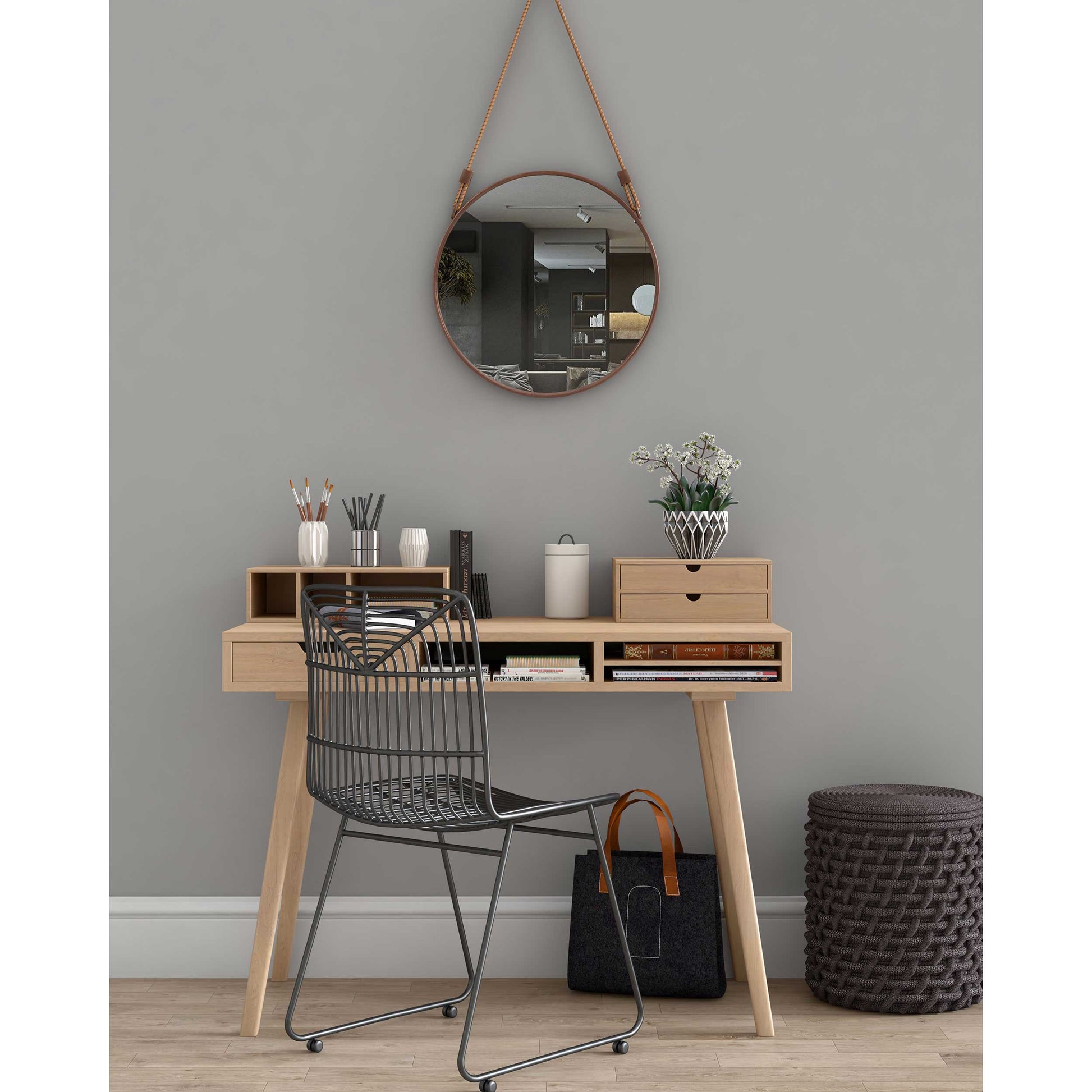 Stylish workspace with a coastal-style round rope mirror on the wall