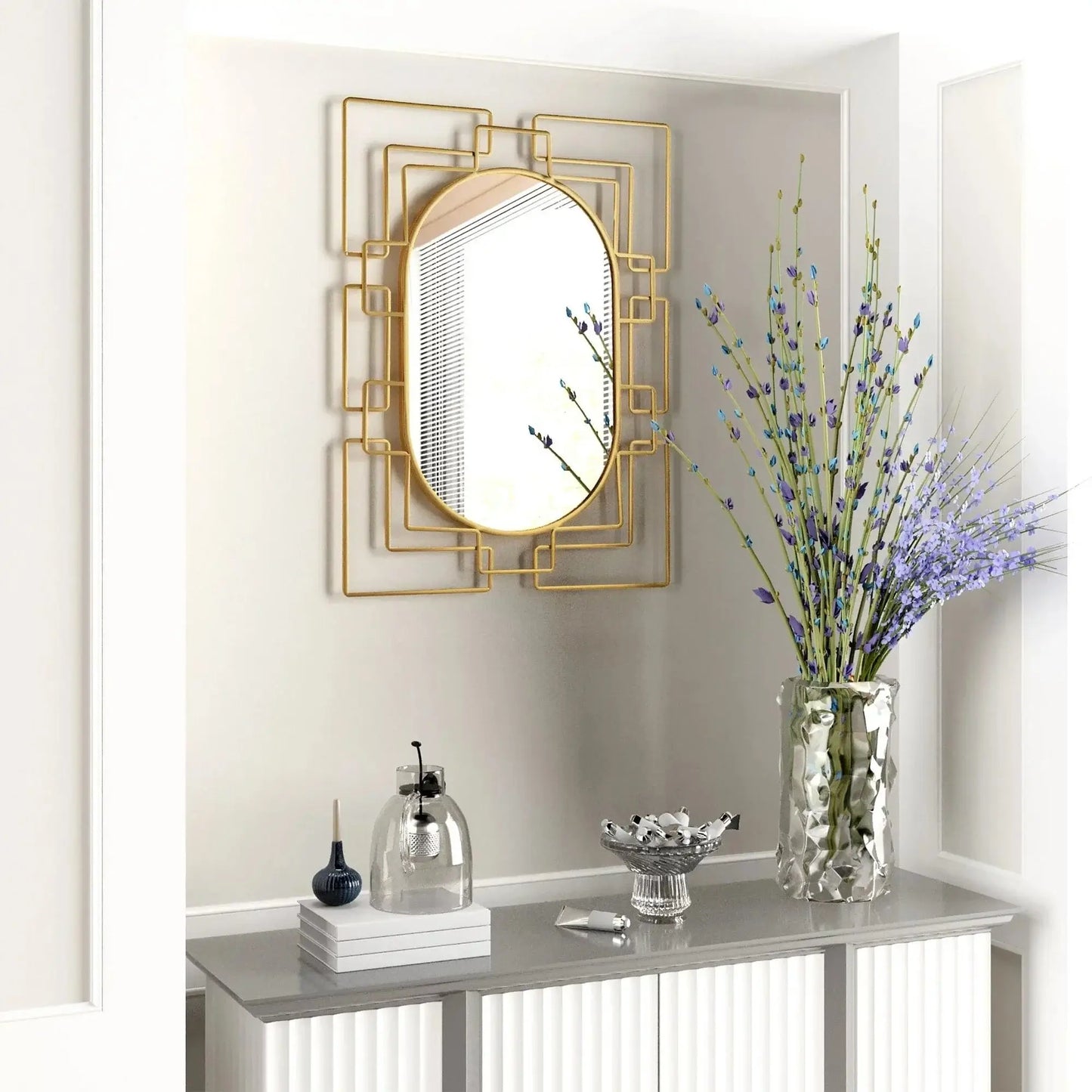 Art deco Gild Design House Deanna Gold Decorative Mirror above a modern entryway console.