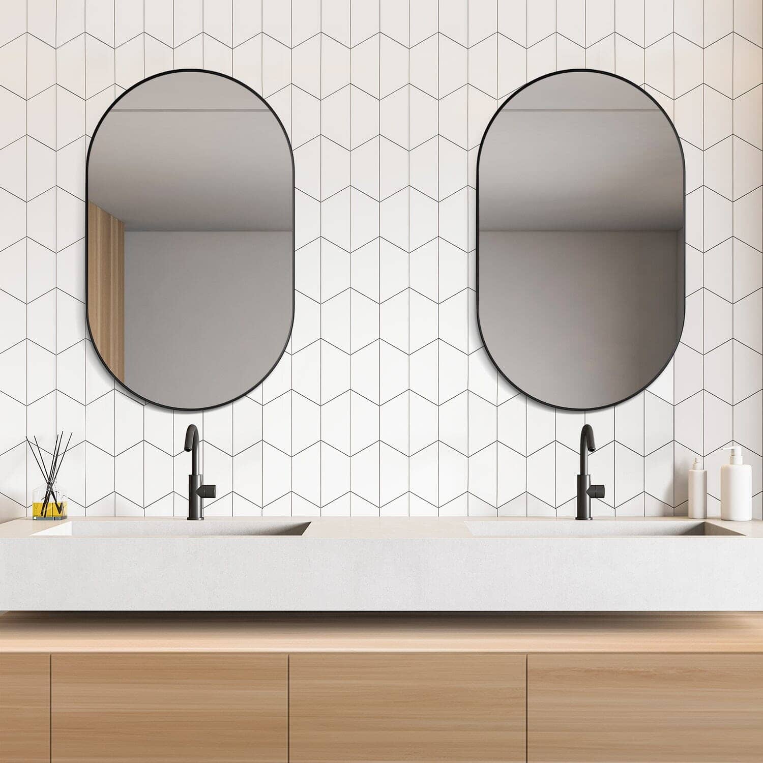 Modern bathroom with Altair Ispra Oval Aluminum Framed Wall Mirrors above dual sinks on geometric tile background.