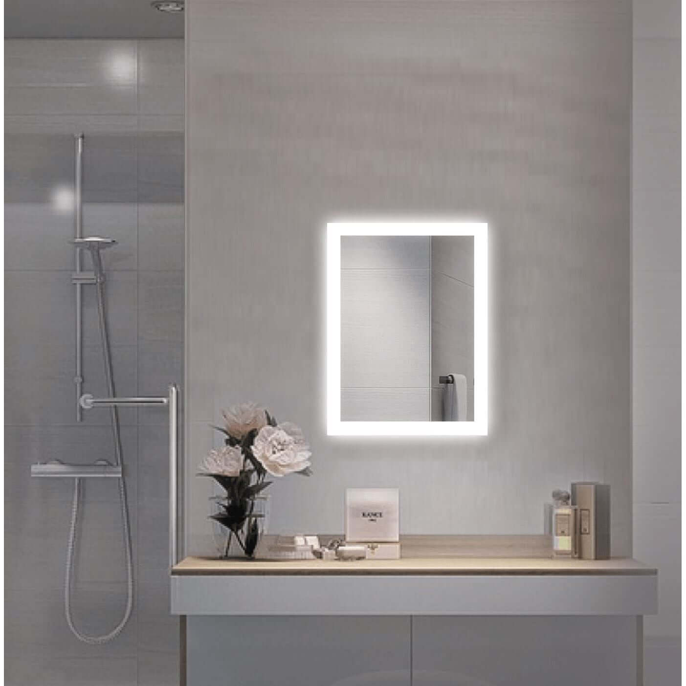 Bijou 15 X 20 LED bathroom mirror by Krugg over a floating vanity sink