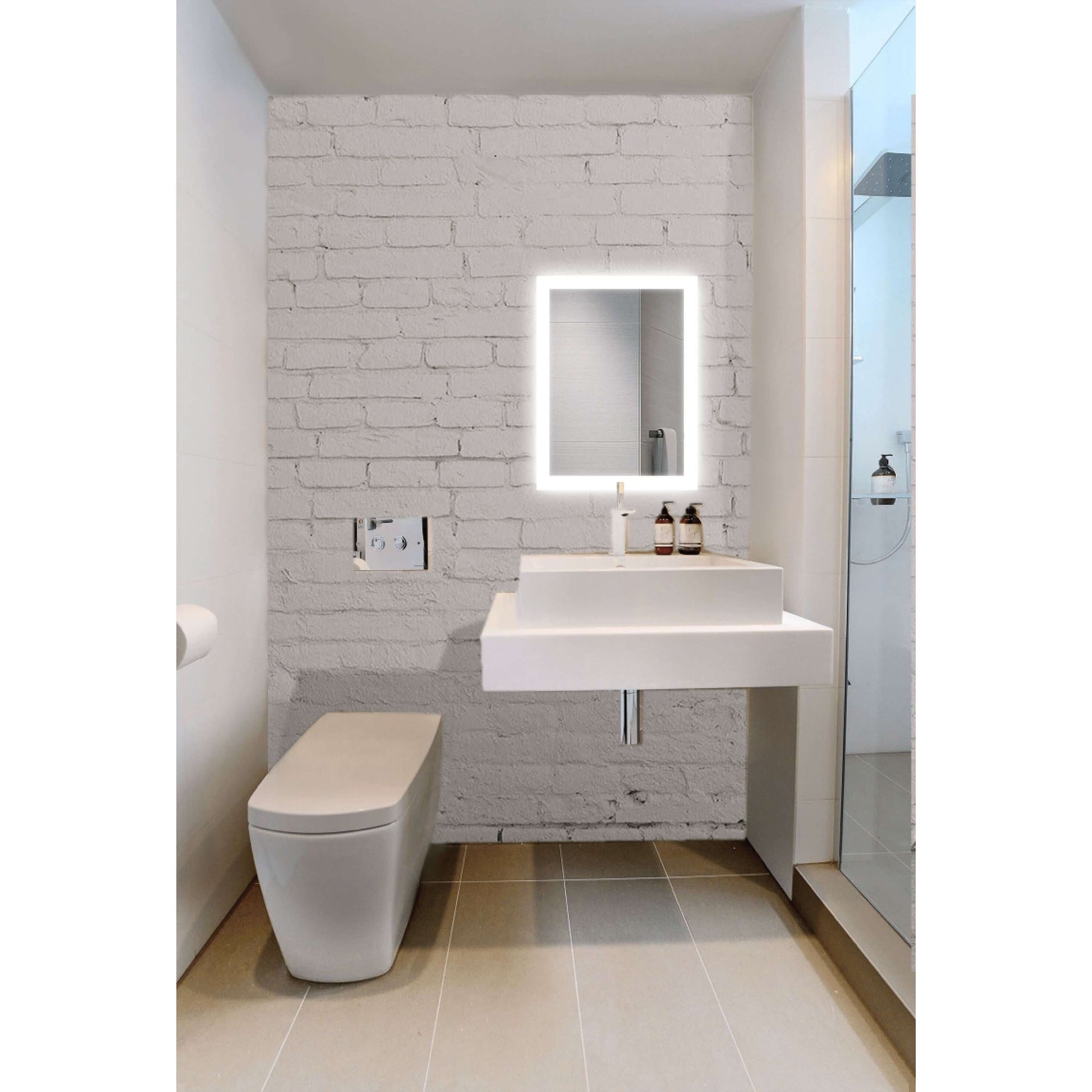 Krugg Bijou 15 X 20 LED mirror installed in a bathroom on white brick wall