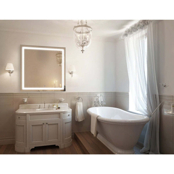 Krugg Icon 36 x 36 LED Bathroom Mirror with Dimmer & Defogger mounted above elegant sink in a luxury bathroom with clawfoot tub.