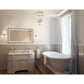 Krugg Icon 2442 LED bathroom mirror above a white vanity and freestanding bathtub