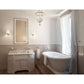 Krugg Icon 2442 LED bathroom mirror above a white vanity with a freestanding tub