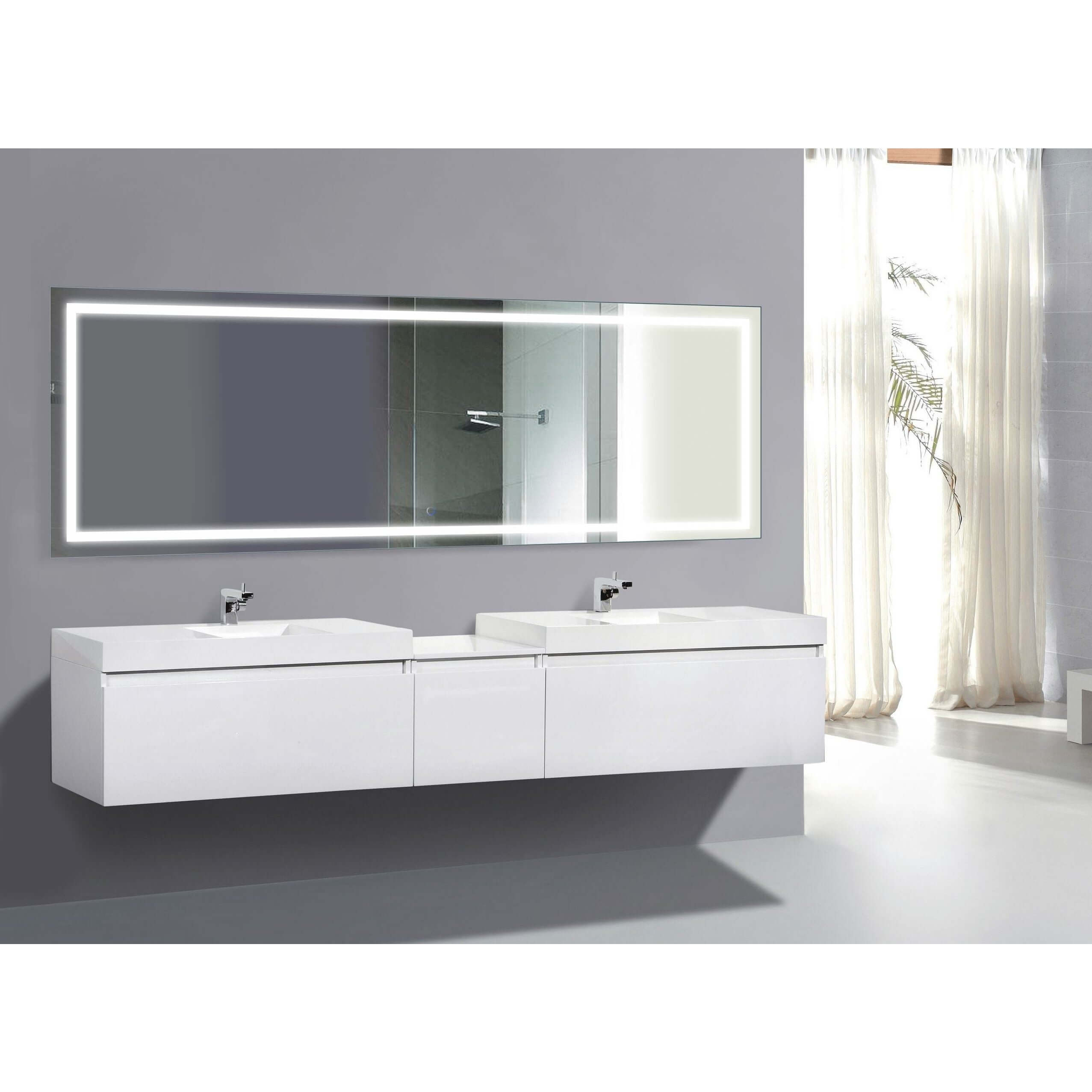 Krugg Icon 84 x 30 LED Bathroom Mirror with Dimmer and Defogger mounted above a double vanity in a modern bathroom.