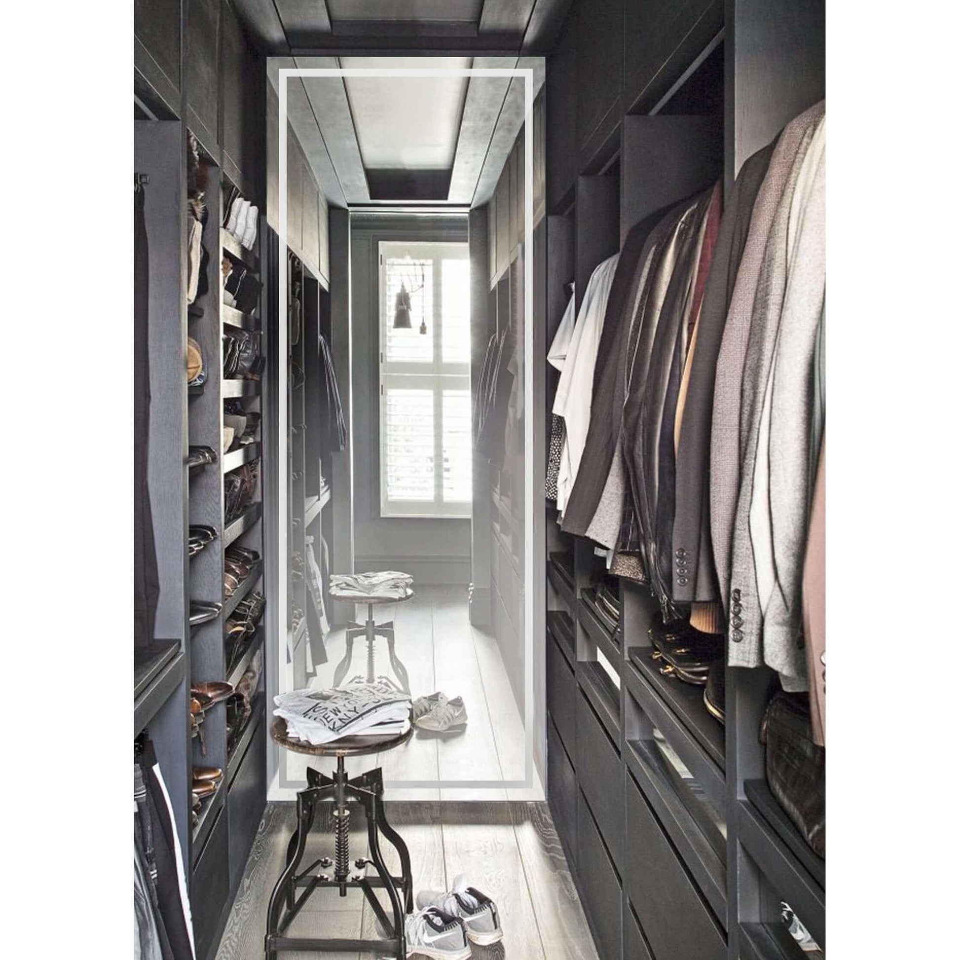 Elegant walk-in closet featuring a Krugg EXL 96 x 36 LED bathroom mirror with superior clarity and perfect LED task lighting.